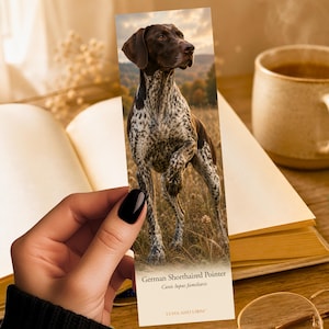 May include: A rectangular bookmark featuring a photographic print of a brown and white spotted German Shorthaired Pointer dog standing in a field. The text reads German Shorthaired Pointer, Canis lupus familiaris, and Luna and Loom.