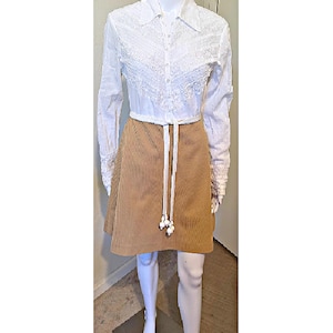 May include: A set of three ceramic mugs with a speckled, matte finish. The mugs are in shades of cream, light gray, and dark gray. Each mug has a simple, modern design and a rounded handle.