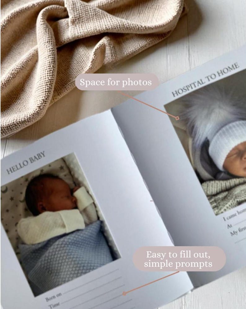 May include: A white baby memory book with a blue and white blanket and a baby in a white onesie. The book has the words "Hello Baby" and "Hospital to Home" on the cover. The book has space for photos and easy to fill out, simple prompts.