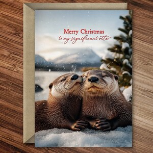Otter kuschelt an Weihnachten - zauberhafte Wickel-Weihnachtskarte