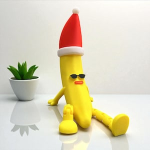 Funny Banana Figurine, Humorous Table Sculpture, Fun Adjustable Statue, Whimsical Shelf Toy, Tabletop Decoration Figurine, Santa Hat Statue