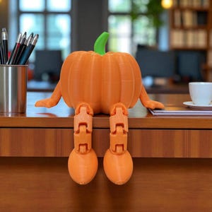 Cute Pumpkin Figurine, Festive Pumpkin Doll, Halloween Doll Decor, Whimsical Festive Decoration, Sitting Pumpkin Figurine