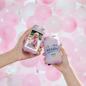 May include: Two pink can coolers. One cooler features a photo of a young girl with the text "Since 1994". The other cooler has the text "Davis 30th Birthday! miami 11.12.24".