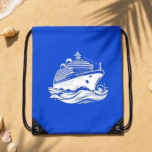 May include: A bright blue drawstring bag featuring a white graphic print of a large cruise ship sailing on stylized ocean waves. The bag has black cord straps and black reinforced corners at the bottom, providing a functional design for carrying items.