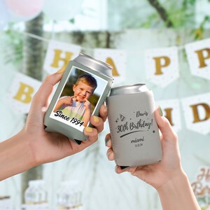 May include: Two gray can coolers. One cooler has a photo of a young boy with the text "Since 1994". The other cooler has the text "Davis 30th Birthday! Miami 11.12.24".
