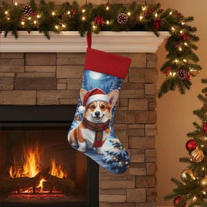 May include: A Christmas stocking with a red cuff and a detailed illustration of a Corgi wearing a Santa hat and scarf. The background depicts a snowy forest scene under a full moon. The stocking hangs near a fireplace.