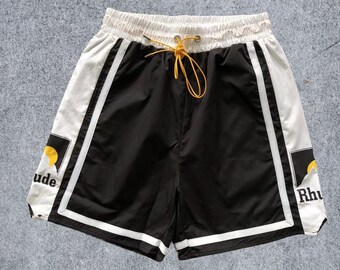 Short de sport décontracté réfléchissant Rhude : d'inspiration américaine, coupe ample, style basket-ball, prêt pour la plage