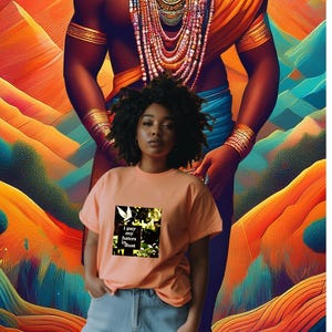 May include: A woman wearing an orange t-shirt with the text "I pay my haters in dust" and a graphic of a bird. The background features a colorful, abstract design with shades of orange, blue, and green.