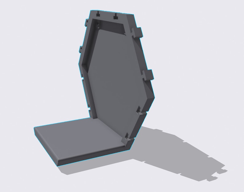 May include: A gray hexagonal box with a hinged lid. The lid is open and the box is sitting on a flat surface.