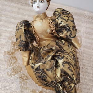 Vintage Musical Harlequin Jester Rotating Doll Gold/Black Jester On a Fancy Pillow Rotating Playing Feelings Musical Doll