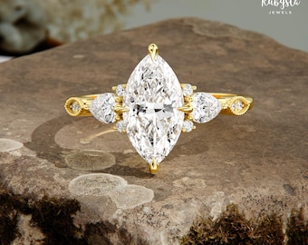 Anillo de compromiso de oro con diamantes de laboratorio de 1,50 quilates, talla marquesa y tres piedras en forma de pera.