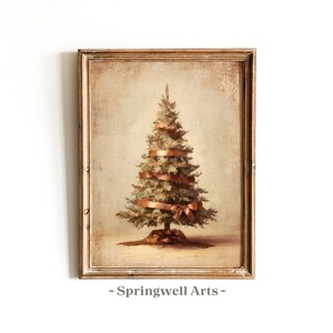 May include: A framed vintage-style painting of a Christmas tree. The tree is decorated with a copper-colored ribbon and bow. The artwork has a warm, neutral color palette and is signed "Springwell Arts" at the bottom.