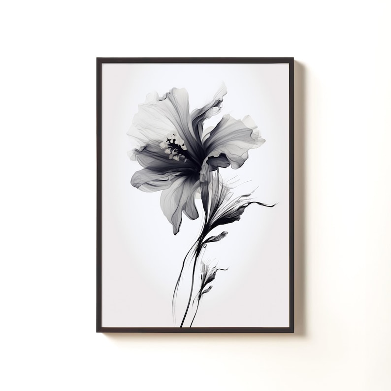 May include: Black and white floral art print in a dark brown frame. The artwork features a detailed illustration of a flower with delicate petals and stems. The grayscale color palette adds a touch of elegance to the botanical theme.