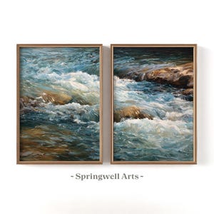 May include: Two framed landscape paintings depict a rushing river with blue and white water, brown rocks, and a wooden frame. The text "- Springwell Arts -" is at the bottom of the image.