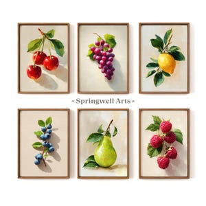 May include: Six framed art prints featuring watercolor paintings of various fruits. The prints include cherries, grapes, a lemon, blueberries, a pear, and raspberries. Each painting is set against a neutral background, with the text "- Springwell Arts -" below the top two prints.