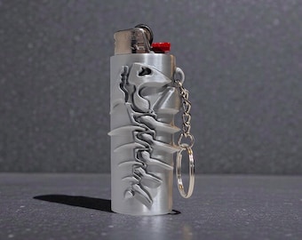 Llavero con estuche para encendedor con esqueleto de pez