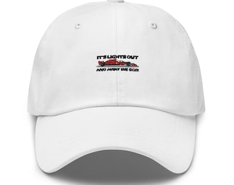 May include: White baseball cap with black embroidery that reads "It's lights out and away we go!" with a red race car graphic.