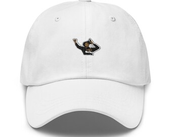 May include: White baseball cap with an embroidered graphic of a person in a black and white outfit with a brown and white hat.
