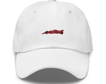 May include: White baseball cap with a red embroidered image of a race car.