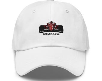 May include: White baseball cap with an embroidered red race car and the text "Formula Car" in black.