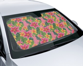 Op de afbeelding: Een roze en gele bloemenautozonnescherm met een tropische print. De zonnescherm is gemaakt van een lichtgewicht materiaal en is ontworpen om de zonnestralen te blokkeren.
