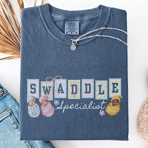 Swaddle Specialist Comfort Colors Tshirt, Labor And Delivery Shirt, Nicu Nurse Gifts, Mother Baby Nurse Shirt, Neonatal Icu Nurse Shirt
