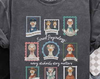May include: Dark gray sweatshirt with a graphic featuring cartoon geese in stamps, each with a different profession or role. Text includes "School Psychology" and "every student's story matters."