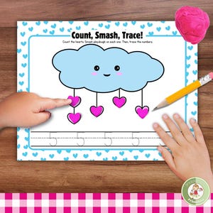 May include: A printable worksheet with a blue cloud and pink hearts. The worksheet instructs children to count the hearts, smash playdough on each one, and then trace the number 5.