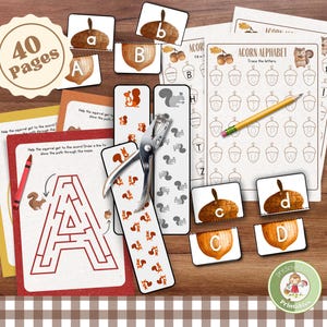 May include: A collection of educational printables for preschoolers, featuring an acorn and squirrel theme. Includes alphabet tracing sheets, letter cards, mazes, and a punch tool. The set is labeled "40 Pages" and includes the text "Acorn Alphabet".