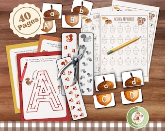Op de afbeelding: Een educatieve set van 40 pagina's met alfabet-oefenbladen in eikelthema, stroken met eekhoornpatronen en letter-matching kaarten. Inclusief een metalen perforator, een geel potlood en een rood kleurpotlood voor doolhof- en schrijfoefeningen.