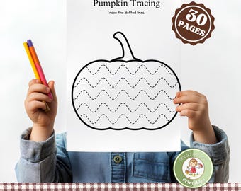 May include: A child holds a white paper with a pumpkin tracing activity. The paper has the text "Pumpkin Tracing" and "Trace the dotted lines." The image includes a brown sticker that says "30 PAGES" and a green sticker that says "Preschool Pop Printables."