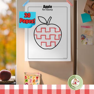 Op de afbeelding: Een witte, bedrukbare werkblad met een appel lijn tracing ontwerp. Het werkblad is gelabeld "Apple line tracing" en bevat de tekst "20 Pages!". Het werkblad is met magneten aan een koelkast bevestigd.