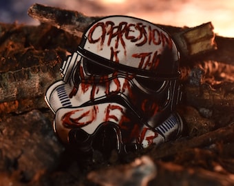 Mask of Fear Enamel Pin – Defaced Trooper Helmet – Rebel Propaganda Lapel Pin