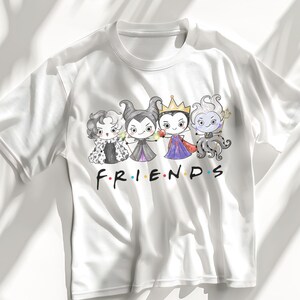 May include: White t-shirt featuring a cartoon graphic of four Disney villains in a Friends-themed design. The villains are Cruella de Vil, Maleficent, the Evil Queen, and Ursula. The word "FRIENDS" is written in the iconic font.