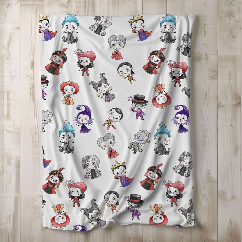 May include: White blanket featuring a repeating pattern of cartoon villains in various colors. The characters are depicted in a whimsical style, with exaggerated features and costumes. The blanket is made of a soft, likely plush material, and is suitable for a bed or couch.