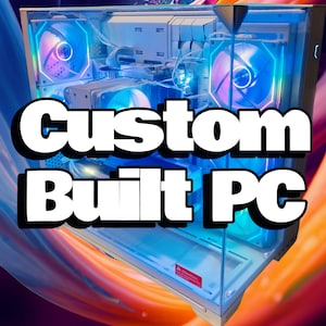 May include: A custom-built PC with a clear case, illuminated by blue and purple LED lights. The text "Custom Built PC" is prominently displayed. The computer components are visible inside the case, including fans and cooling systems.
