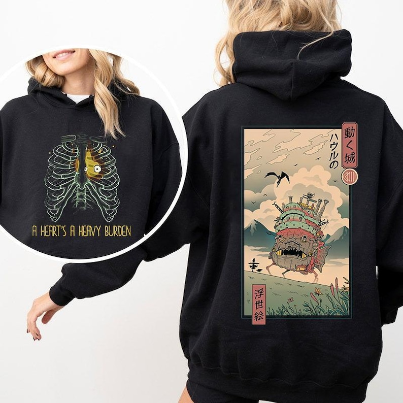 a woman wearing a black hoodie with an image of a skeleton on it