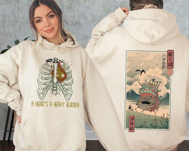 a woman wearing a hoodie with a japanese painting on it