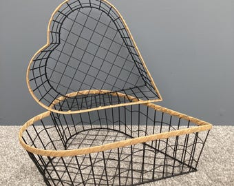 Heart shaped woven metal fruit baskets with raffia edging. 2 sizes available