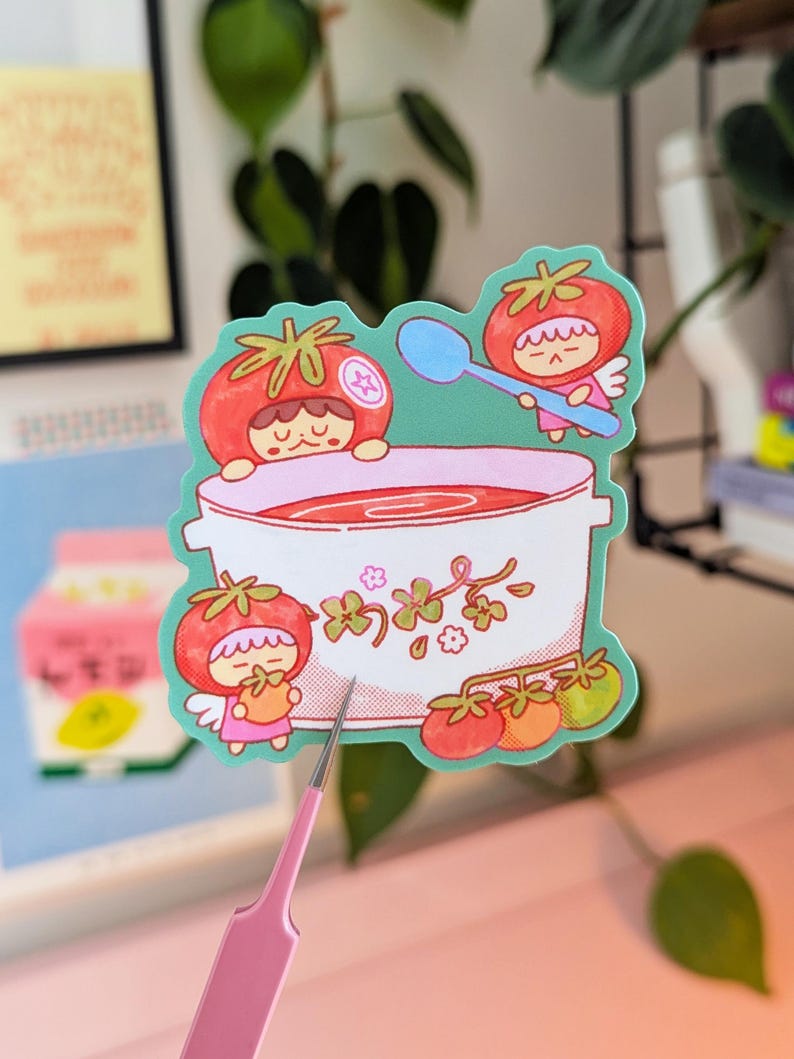 Cute illustrated sticker of tomato fairies making a big, warming bowl of tomato soup!