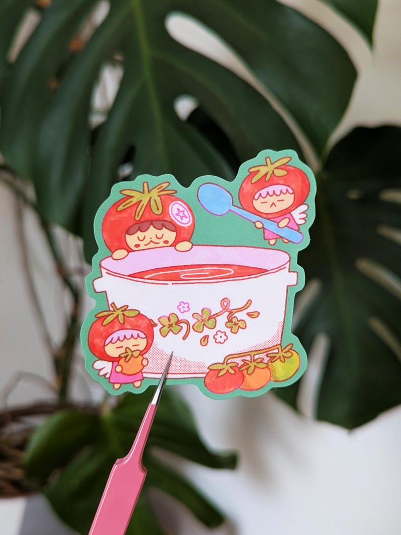Cute illustrated sticker of tomato fairies making a big, warming bowl of tomato soup!