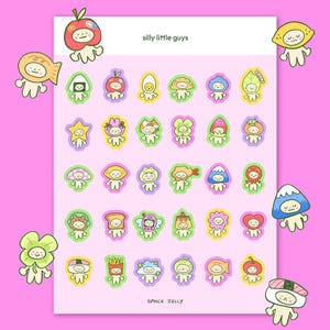 Puede incluir: Una hoja de pegatinas coloridas con personajes caprichosos con diseños temáticos de comida y naturaleza. Las pegatinas están rodeadas por un fondo rosa. El texto "silly little guys" y "space jelly" es visible.