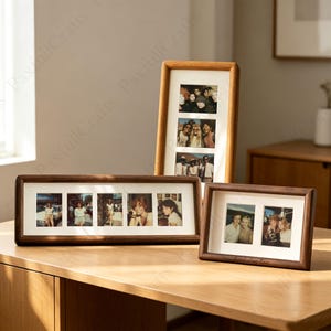 May include: Several wooden photo frames of varying sizes, displaying multiple photographs. The frames are a warm brown colour, with rectangular and vertical designs. The photos show people in different settings.