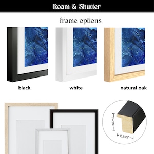 May include: Three frame options for a picture: black, white, and natural oak. The frames are 0.875 inches wide. The image shows a blue abstract painting.