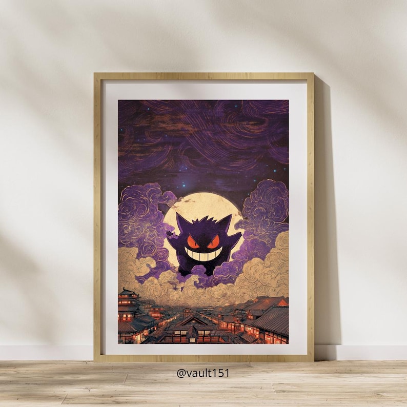 May include: Framed art print depicting a purple Gengar character against a full moon, set above a Japanese cityscape. The artwork has a vintage style, presented in a wooden frame with a white border. The background is a dark purple sky with swirling clouds.