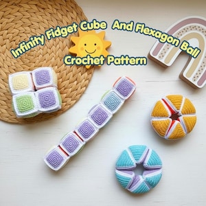 May include: A collection of colorful crochet fidget toys, including a cube, an infinity fidget, and a flexagon ball. The toys are in shades of purple, green, yellow, and blue. The text "Infinity Fidget Cube And Flexagon Ball Crochet Pattern" is displayed.
