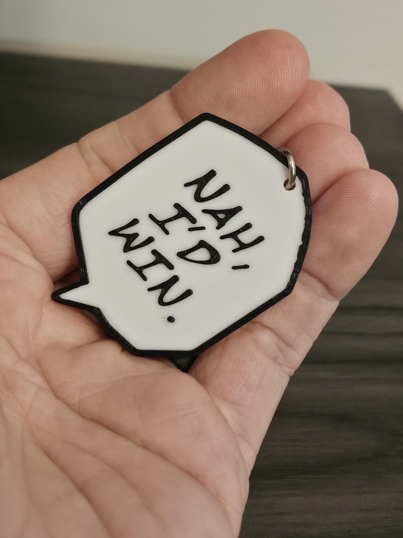 May include: White speech bubble keychain with black outline and the text "NAH I'D RATHER NOT."