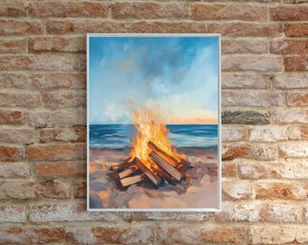 Pode incluir: Uma pintura emoldurada retrata uma cena de praia com uma fogueira. A obra apresenta um fogo laranja e amarelo vibrante queimando na areia, com o oceano e o céu ao fundo. A pintura está em uma moldura branca e é exibida contra uma parede de tijolos.