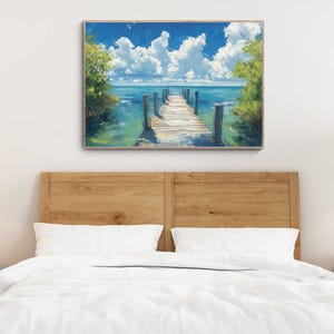a bed with a white comforter and a painting on the wall