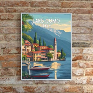 May include: A vintage travel poster featuring a colorful illustration of Lake Como, Italy. The poster features a picturesque view of a town with buildings, a church, and boats on the water. The text "LAKE COMO ITALY" is printed in white at the top of the poster.